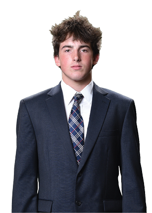 A young man wearing a white and black jersey with the number 14 on it. Description generated by AI