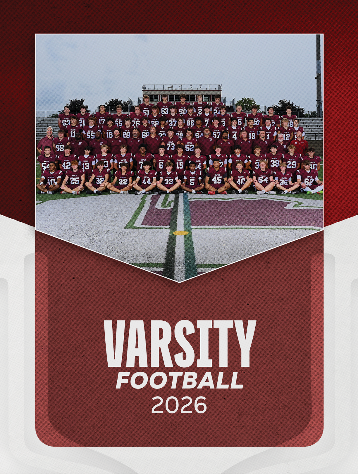 A group of football players sitting on a bench. Description generated by AI