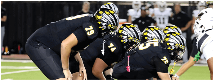 A football player is sliding on the ground. Description generated by AI