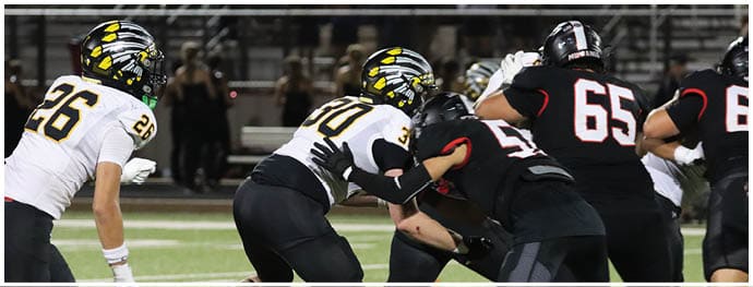 A football player is sliding on the ground. Description generated by AI