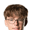 Person with curly hair and light eyes looking forward against a white background. Description generated by AI