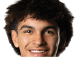Person with curly hair and light eyes looking forward against a white background. Description generated by AI