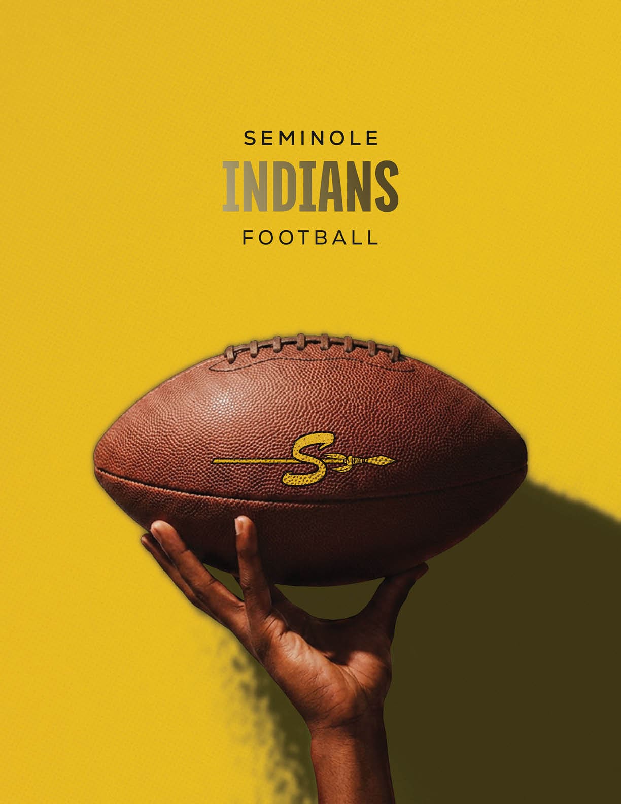 A hand is holding a football with a yellow “S" and spear logo against a yellow background with the text Seminole Indians Football above. Description generated by AI