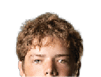 Person with curly hair and light eyes looking forward against a white background. Description generated by AI
