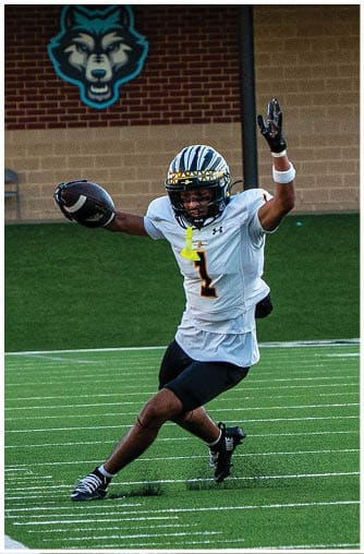 A football player running on the field. Description generated by AI
