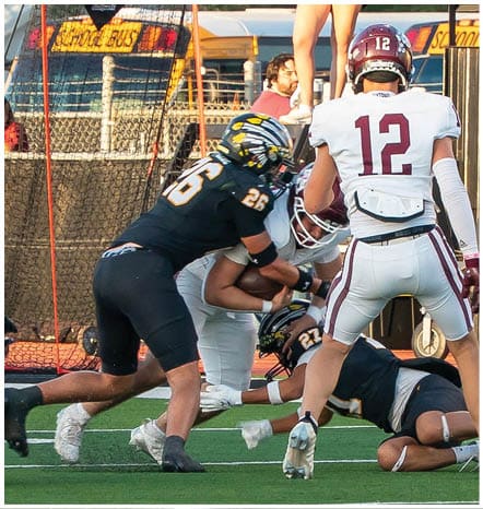 A football player running on the field. Description generated by AI
