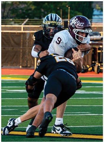 A football player running on the field. Description generated by AI