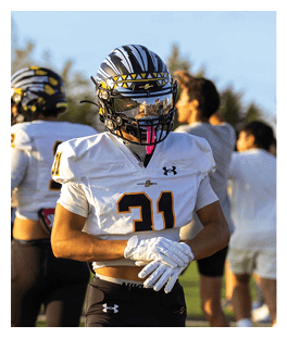 Two football players wearing black jerseys and holding hands. Description generated by AI