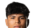 Person with curly hair and light eyes looking forward against a white background. Description generated by AI