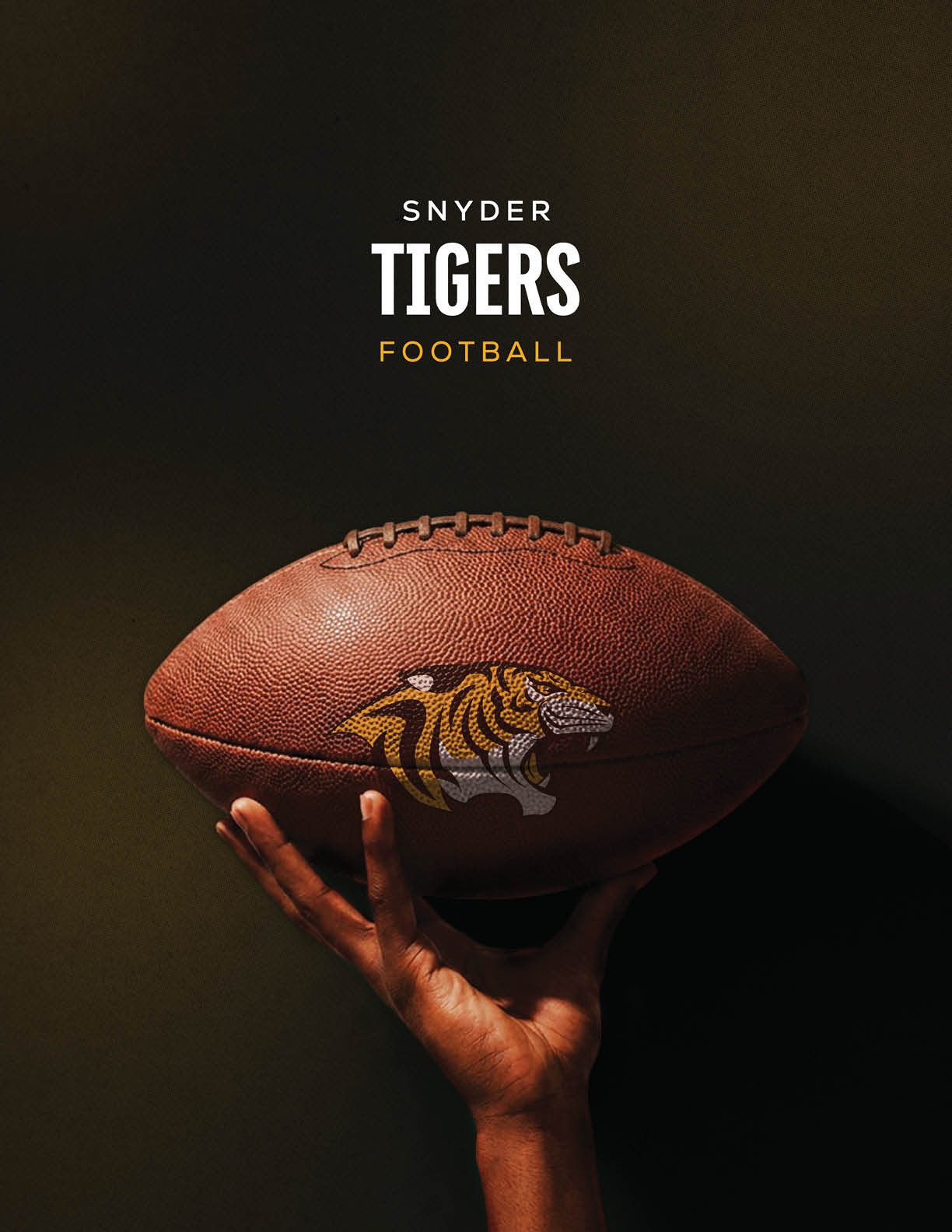 A hand is holding a football with a tiger logo on it against a dark background with the text Snyder Tigers Football above. Description generated by AI
