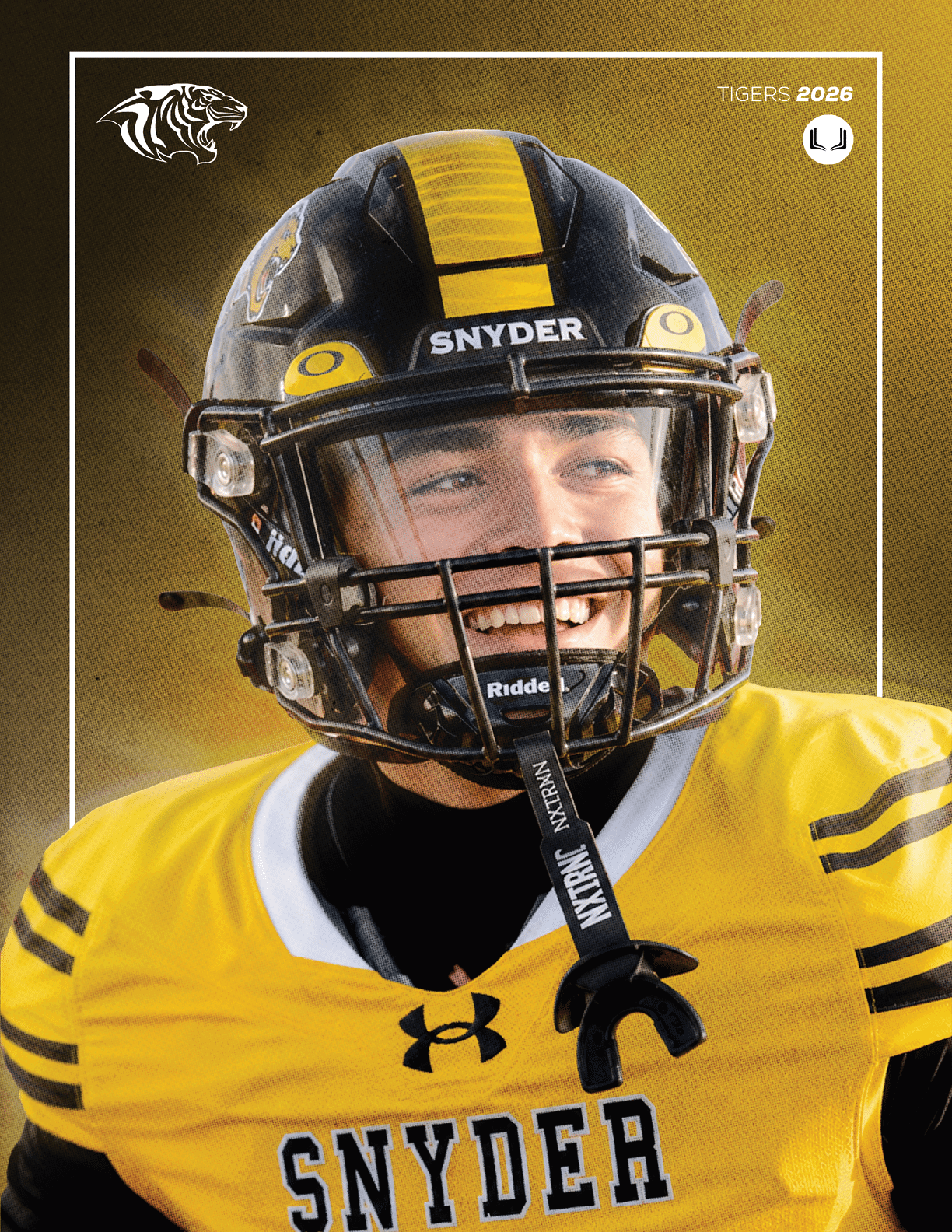 A person wearing a yellow and black football uniform with “SNYDER" on the chest and a black helmet with a yellow stripe is smiling on a football field. Description generated by AI