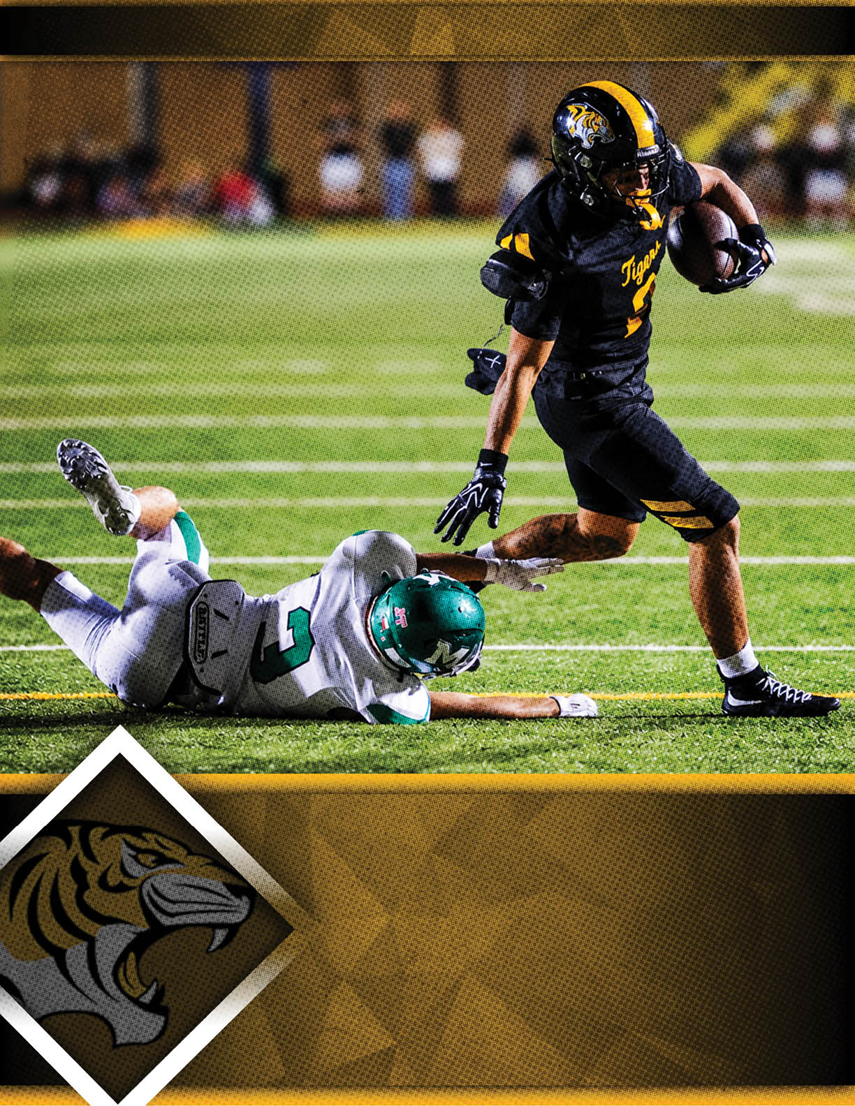 A person in a black and yellow football uniform is running with the ball while another person in a white and green uniform is falling on the field behind them during a game. Description generated by AI