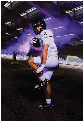 A football player running on the field. Description generated by AI