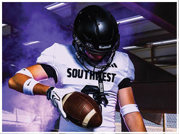 A football player running on the field. Description generated by AI