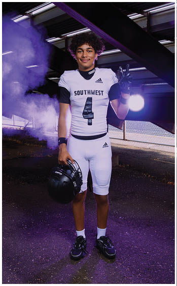 A football player running on the field. Description generated by AI