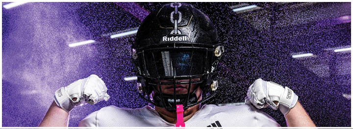 A football player is sliding on the ground. Description generated by AI