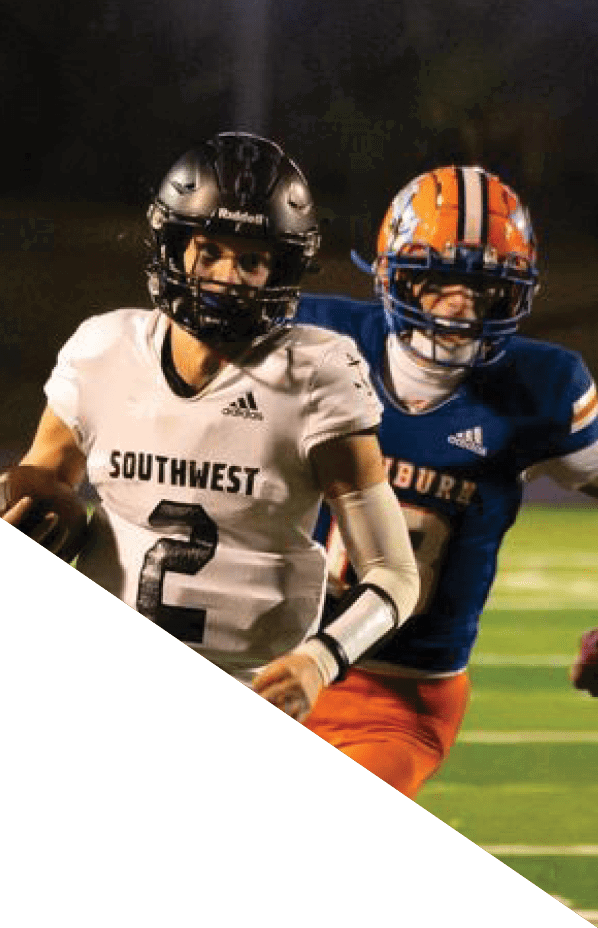 A football player is kneeling on the field, holding his helmet in his hands. AI generated content