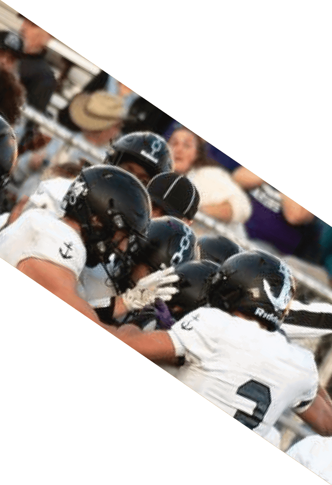 Four football players pose for a picture on the field. AI generated content