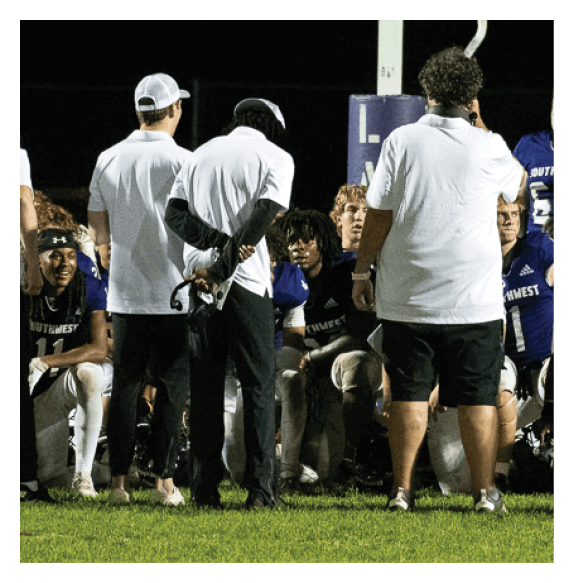 Two football players wearing Vista jerseys and holding hands. AI generated content