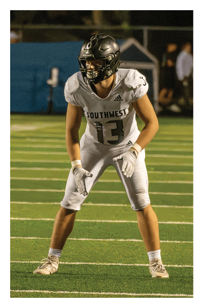 A football player wearing a black and white uniform with the number 10 on the back. AI generated content