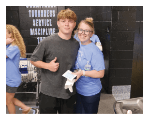 Two people standing in a room, one holding a piece of paper. AI generated content