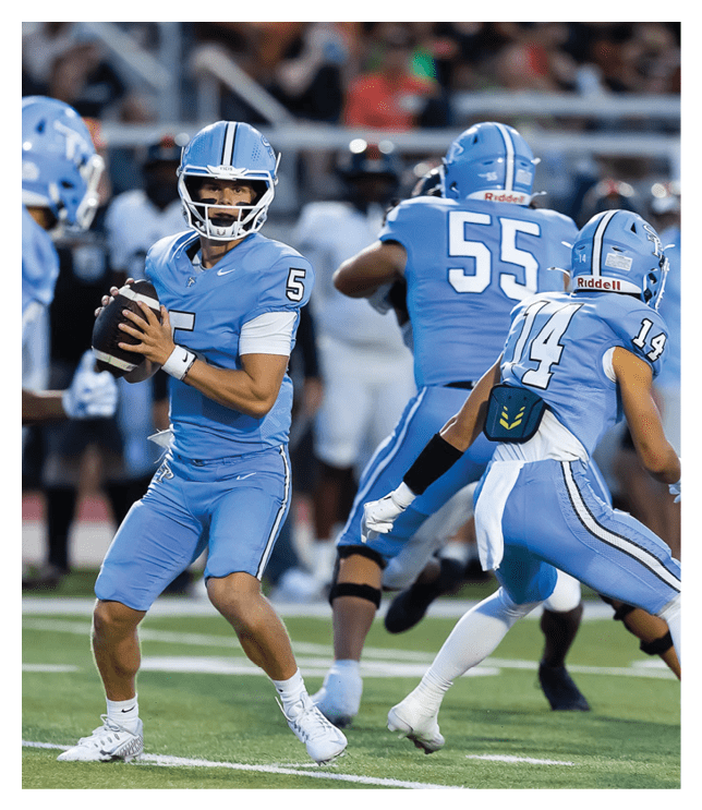 A football player in a blue uniform is holding a football. AI generated content