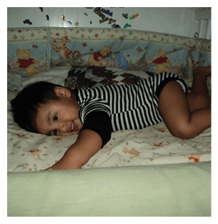 A young child is lying on a bed with a Winnie the Pooh blanket. AI generated content