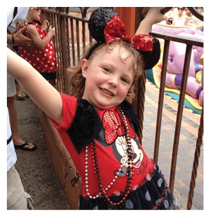 A young girl wearing a Minnie Mouse outfit and holding onto a railing. AI generated content