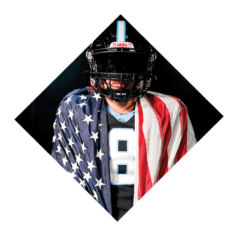 A football player wearing a helmet and jersey with the number 8 on it stands in front of an American flag. AI generated content