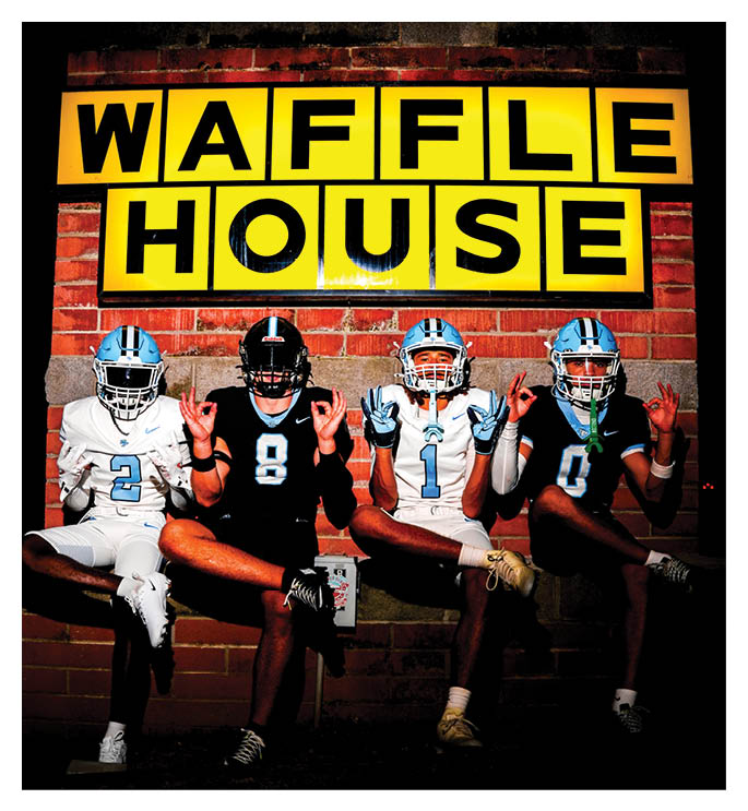 Four football players pose in front of a Waffle House sign. AI generated content