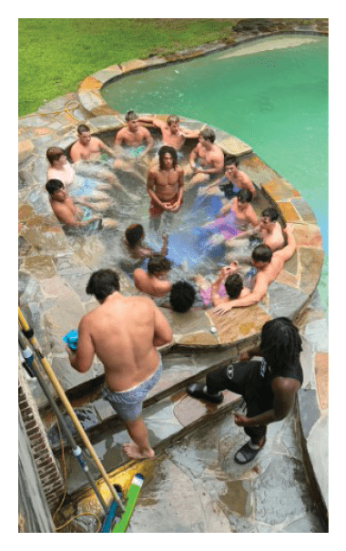 A group of people are in a swimming pool, enjoying the water. AI generated content
