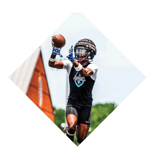 A football player in a black jersey leaps into the air to catch a football. AI generated content