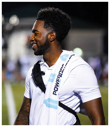 A man wearing a white shirt and a backpack is smiling. AI generated content