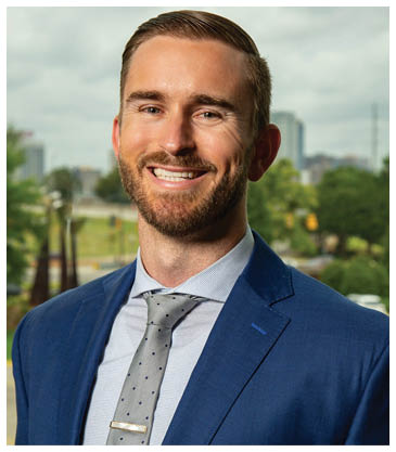 A man wearing a suit and tie is smiling for the camera. AI generated content