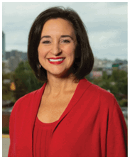 A woman wearing a red shirt and smiling. AI generated content