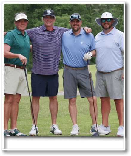Four men are standing on a golf course, holding their golf clubs. AI generated content