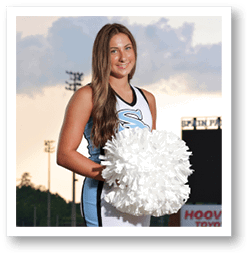 A woman in a blue and white cheerleading outfit holds a white pom pom. AI generated content