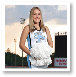 A cheerleader for the University of South Carolina stands on a football field. AI generated content