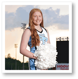A cheerleader in a blue and white uniform stands on a football field holding a large white pom pom. AI generated content