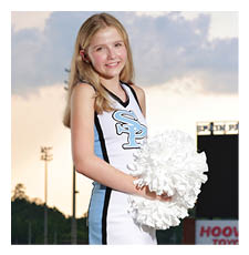 A cheerleader in a blue and white uniform holds a pom pom. AI generated content