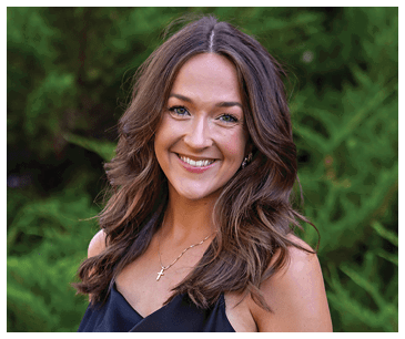 A woman in a black dress is smiling for the camera. AI generated content