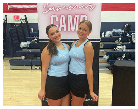 Two women in blue dresses pose in front of a sign for a summer camp. AI generated content