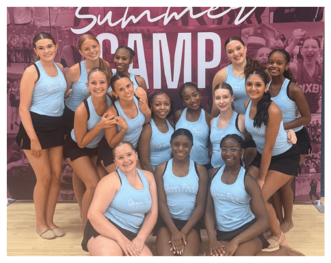 A group of young women pose for a picture in front of a banner. AI generated content