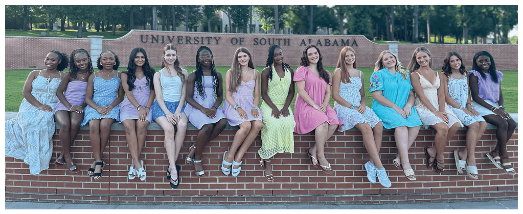 A group of women are posing for a picture in front of a brick wall. AI generated content