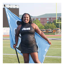 A woman in a blue and black outfit holds a blue flag. AI generated content