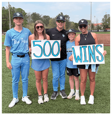 A group of people posing for a picture on a baseball field. AI generated content