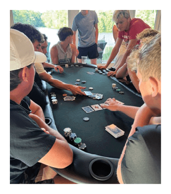 A group of people are playing poker at a table. AI generated content