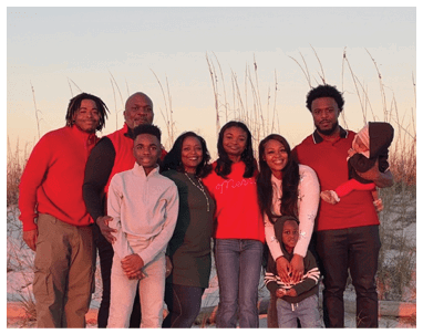A family posing for a photo on the beach. AI generated content