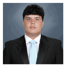 A man wearing a suit and tie stands in front of a blue background. AI generated content