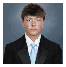 A young man wearing a suit and tie poses for a picture. AI generated content